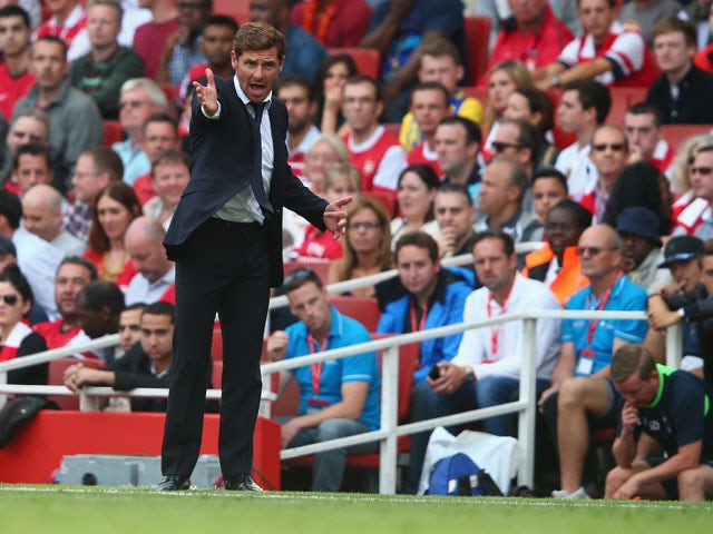 Andre Villas-Boas of Tottenham Hotspur gesticulates during the Barclays Premier League match between Arsenal and Tottenham Hotspur at Emirates Stadium on September 01, 2013