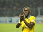 Arsenal defender Bacary Sagna applauds the fans after a pre-season game in Indonesia on July 14, 2013