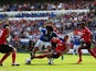 Ben Turner of Cardiff tackles Marouane Fellaini of Everton during the Barclays Premier League match between Cardiff City and Everton at Cardiff City Stadium on August 31, 2013