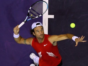 Spanish tennis player Carlos Moya serves the ball at the Madrid Masters on October 14, 2008