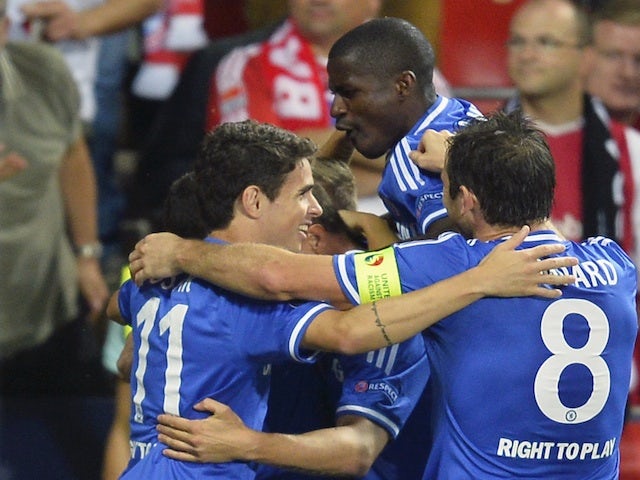 Chelsea players surround Fernando Torres after his Super Cup strike against Bayern Munich on August 30, 2013