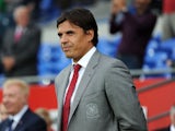 Wales national team manager Chris Coleman looks on during the International Friendly match between Wales v Ireland at the Cardiff City Stadium on August 14, 2013