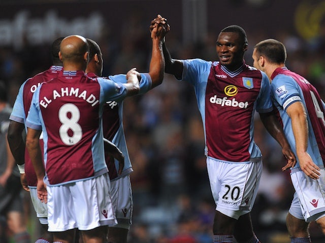 Villa players congratulate Christian Benteke following a goal against Rotherham on August 28, 2013