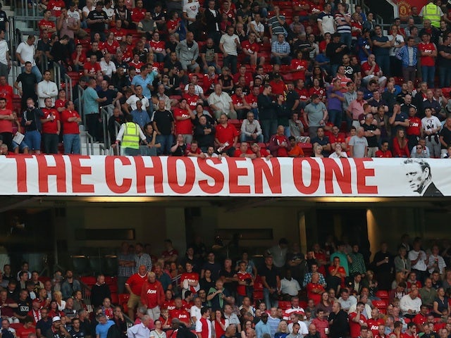United fans display a banner in the Stretford End stating David Moyes is 'The Chosen One' on August 26, 2013