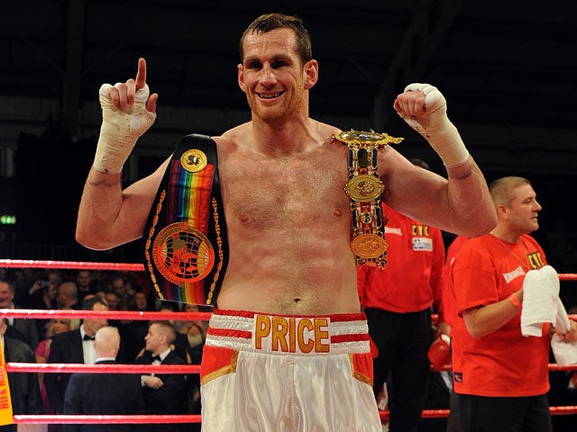 David Price of England poses with the belts following his British & Commonwealth Heavyweight title fight against Matt Skelton of England at Aintree Racecourse on November 30, 2012