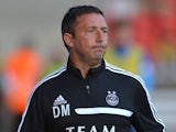 Aberdeen manager Derek McInnes jogs onto the pitch during the Pre Season Friendly match between Aberdeen and FC Twente at Pittodrie Stadium on July 26, 2013