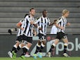 Udinese's Emanuel Badu celebrates with team mates after scoring the opening goal against 