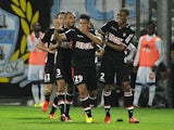 Monaco's Emmanuel Riviere is congratulated by team mates after scoring the winning goal against Marseille on September 1, 2013