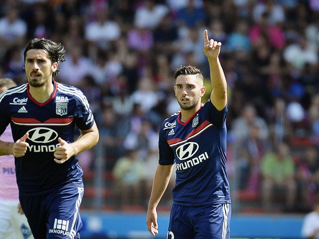 Olympique Lyonnais midfielder Jordan Ferri celebrates after scoring against Evian on August 31, 2013
