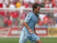 Graham Zusi #8 of Sporting Kansas City controls the ball against the Chicago Fire during an MLS match at Toyota Park on July 7, 2013
