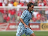 Graham Zusi #8 of Sporting Kansas City controls the ball against the Chicago Fire during an MLS match at Toyota Park on July 7, 2013