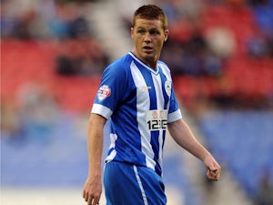 James McCarthy of Wigan Athletic looks on during the Sky Bet Championship match between Wigan Athletic and Doncaster Rovers at DW Stadium on August 20, 2013