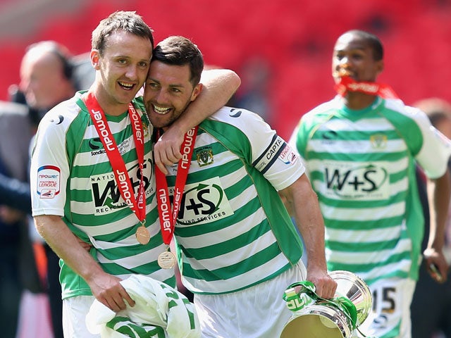 James McAllister the captain of Yeovil Town celebrates victory with team mate Gavin Williams during the NPower League One play off final between Brentford and Yeovil Town at Wembley Stadium on May 19, 2013