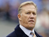 John Elway, executive vice president of football operations of the Denver Broncos watches the team warm up before the start of the Broncos game against the Baltimore Ravens at M&T Bank Stadium on December 16, 2012 