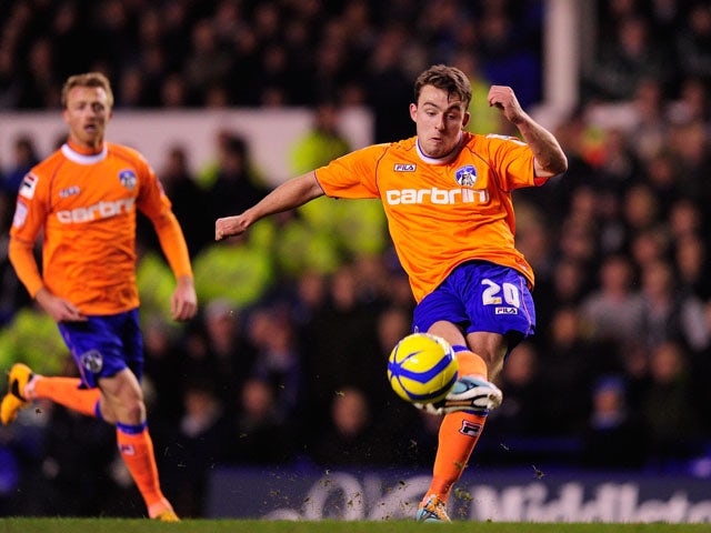 Oldham player Jose Baxter curls a shot against the woodwork during the FA Cup Fifth Round Replay between Everton and Oldham Athletic at Goodison Park on February 26, 2013