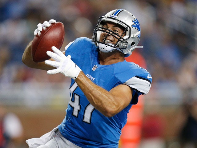 Joseph Fauria #47 of the Detroit Lions celebrates after scoring a third quarter touchdown while playing the New England Patriots during a pre season game at Ford Field on August 22, 2013
