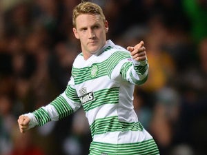 Celtic crush Dundee to close in on title