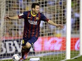Barcelona's Lionel Messi celebrates after scoring the opening goal during the match against Valencia on September 1, 2013