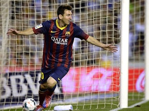 Messi hat-trick downs Valencia