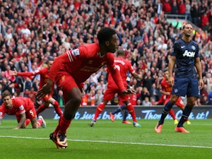 Daniel Sturridge of Liverpool celebrates scoring the opening goal during the Barclays Premier League match between Liverpool and Manchester United at Anfield on September 01, 2013