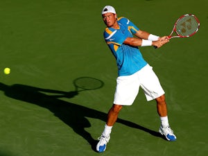 Lleyton Hewitt of Australia returns a shot to Ryan Harrison during the Citi Open at the William H.G. FitzGerald Tennis Center on July 30, 2013