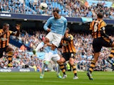 Manchester City's English defender Joleon Lescott heads the ball during the English Premier League football match between Manchester City and Hull City at the Etihad Stadium in Manchester, northwest England, on August 31, 2013