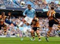 Manchester City's English defender Joleon Lescott heads the ball during the English Premier League football match between Manchester City and Hull City at the Etihad Stadium in Manchester, northwest England, on August 31, 2013