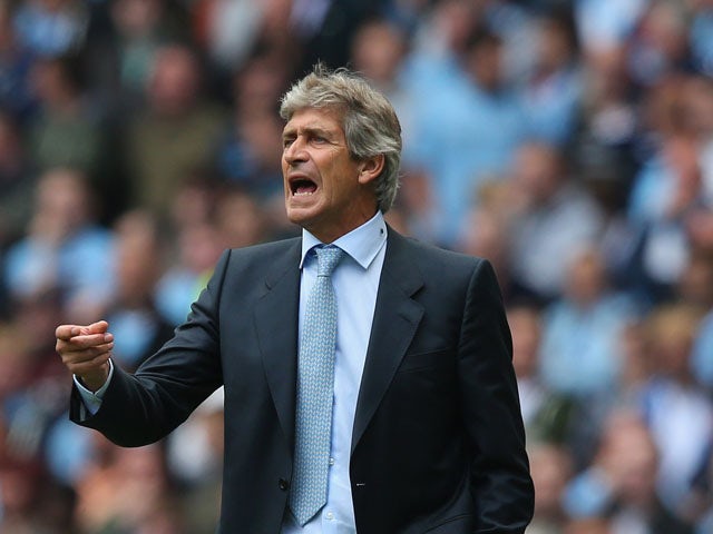 Manuel Pellegrini the manager of Manchester City during the Barclays Premier League match between Manchester City and Hull City at the Etihad Stadium on August 31, 2013