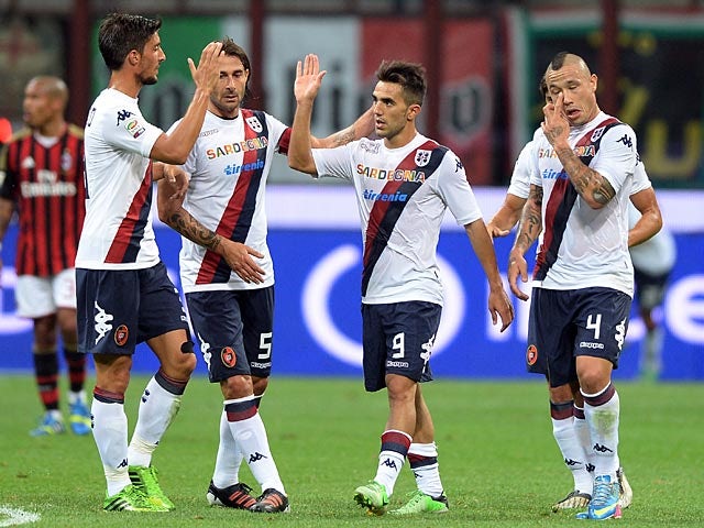 Cagliari's Marco Sau celebrates his goal with team mates during the match against AC Milan on September 1, 2013