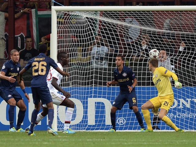Milan striker Mario Balotelli scores against PSV Eindhoven on August 28, 2013