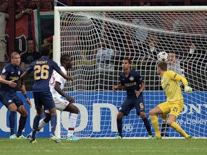 Milan striker Mario Balotelli scores against PSV Eindhoven on August 28, 2013