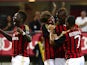 Milan's Mario Balotelli is congratulated by team mates after scoring his team's third goal against Cagliari on September 1, 2013