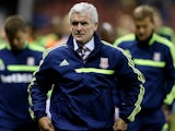 Stoke boss Mark Hughes walks to the dugout prior to their game with Walsall on August 28, 2013