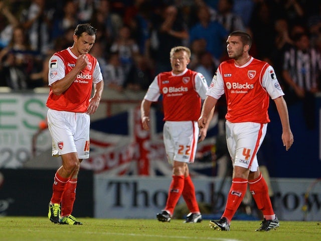 Morecambe players look dejected after a Newcastle goal on August 28, 2013