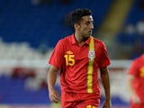 Neil Taylor of Wales in action during the International Friendly match between Wales v Ireland at the Cardiff City Stadium on August 14, 2013