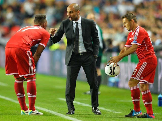 Bayern boss Pep Guardiola instructs his players during the European Super Cup with Chelsea on August 30, 2013
