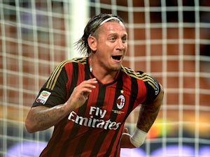 Milan's Philippe Mexes celebrates after scoring his team's second goal against Cagliari on September 1, 2013