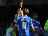 The Referee Steve Bratt shows a red card to David Connolly of Portsmouth during the Sky Bet League Two match between Portsmouth and Chesterfield at Fratton Park on August 31, 2013
