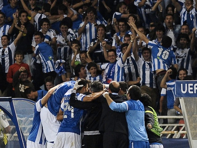 Real Sociedad players celebrate after Carlos Vela gives them the lead against Lyon on August 28, 2013