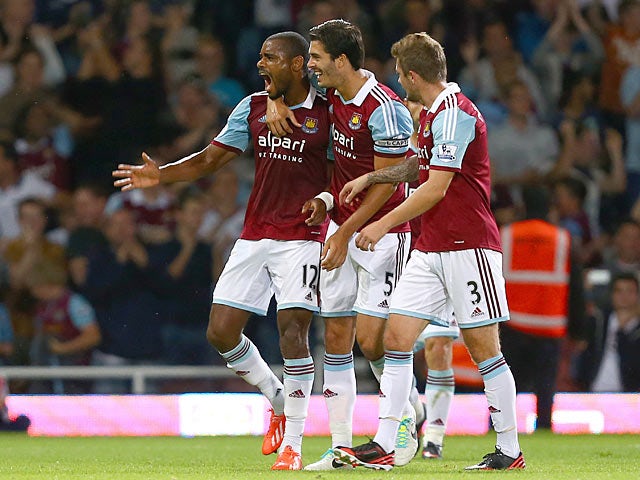 West Ham's Ricardo Vaz Te celebrates with team mates after scoring the opening goal against Cheltenham during their League Cup match on August 27, 2013