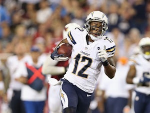 Wide receiver Robert Meachem #12 of the San Diego Chargers runs with the football after a reception against the Arizona Cardinals during the preseason NFL game at the University of Phoenix Stadium on August 24, 2013