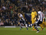 West Brom's Saido Berahino scores a penalty to seal his hat-trick against Newport during their League Cup match on August 27, 2013