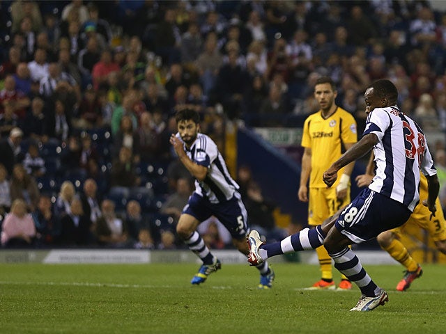 West Brom's Saido Berahino scores a penalty to seal his hat-trick against Newport during their League Cup match on August 27, 2013