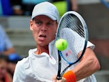 Tomas Berdych in action against Julien Benneteau during their US Open third round match on September 1, 2013