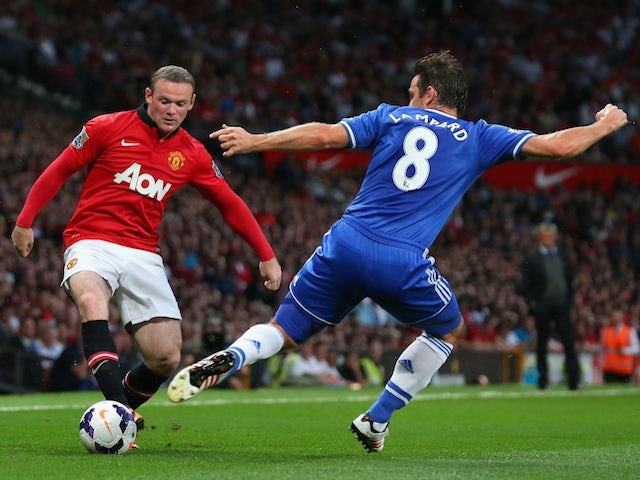 United's Wayne Rooney battles Frank Lampard for possession on August 26, 2013