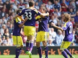 Ben Davies of Swansea City celebrates with team mates after scoring the first goal during the Barclays Premier League match between West Bromwich Albion and Swansea City at The Hawthorns on September 01, 2013