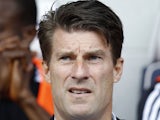 Swansea City's Danish manager Michael Laudrup awaits kick off in the English Premier League football match between West Bromwich Albion and Swansea City at The Hawthorns in West Bromwich, central England, on September 1, 2013