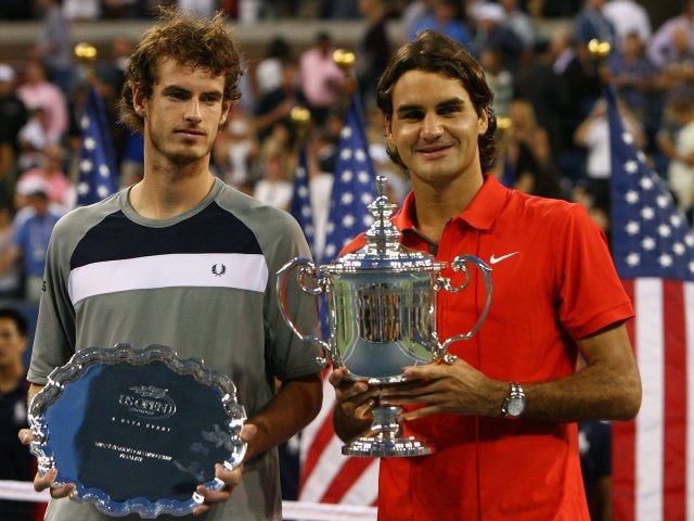 Andy Murray and Roger Federer pose with their trophies after the men's 2008 US Open final.