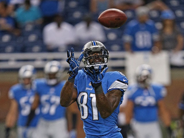 Calvin Johnson #81 of the Detroit Lions warms up prior to the start of the pre-season game against the New York Jets at Ford Field on August 9, 2013