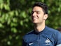 French national football team midfielder Clement Grenier arrives for a training session in Clairefontaine-en-Yvelines, outside Paris on September 2, 2013 
